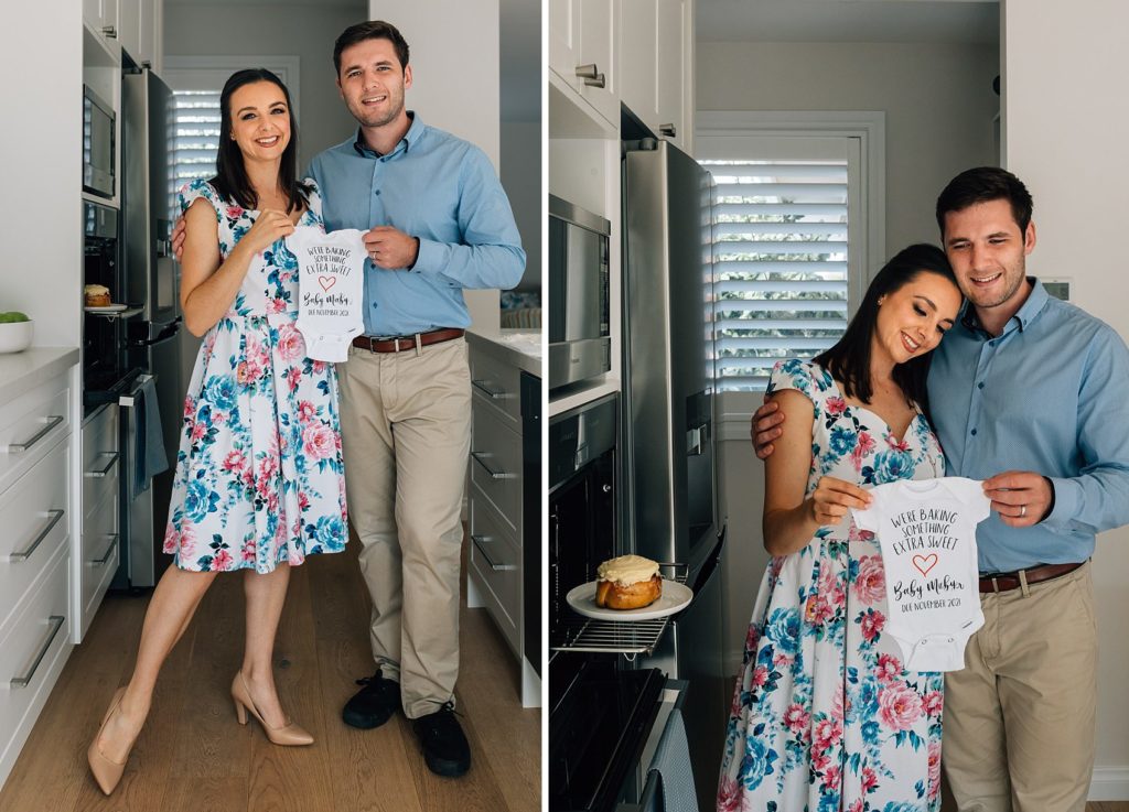 man and woman holding special onesie with a bun in the oven, funny pregnancy announcement photography session