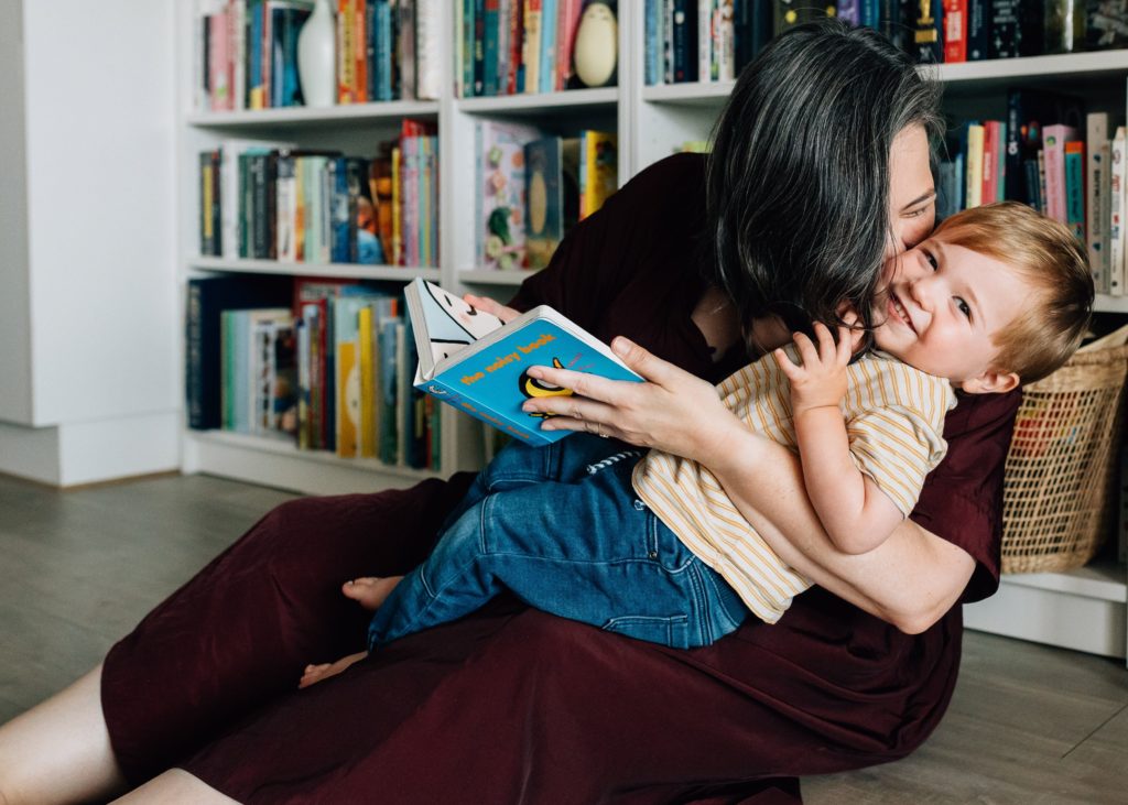 mother kissing son sitting on lap plus size family photography Melbourne 