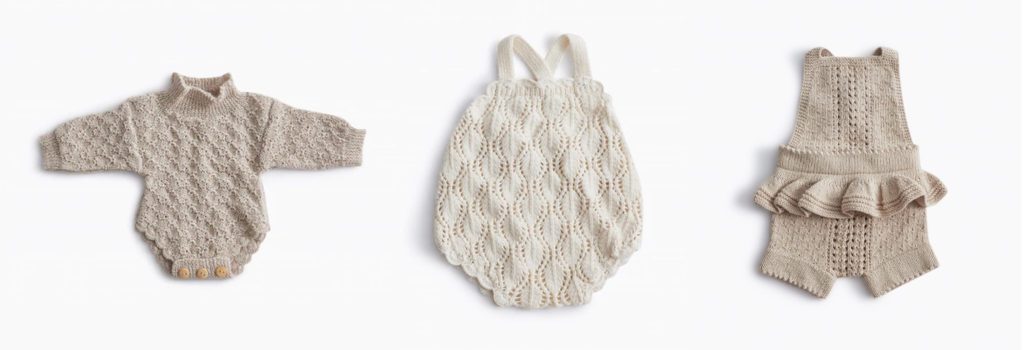 flatlay of Hank Knitwear rompers, examples of lovely newborn photoshoot outfits