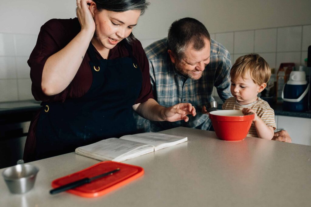 Mum, Dad and boy baking something in kitchen, value of photography, especially plus size family photos